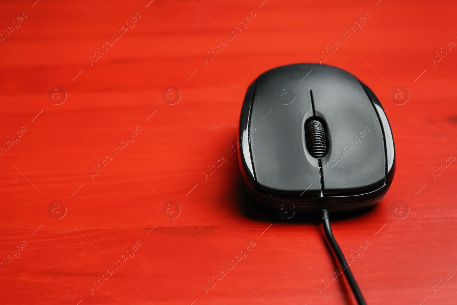 Photo of Modern computer mouse on color background