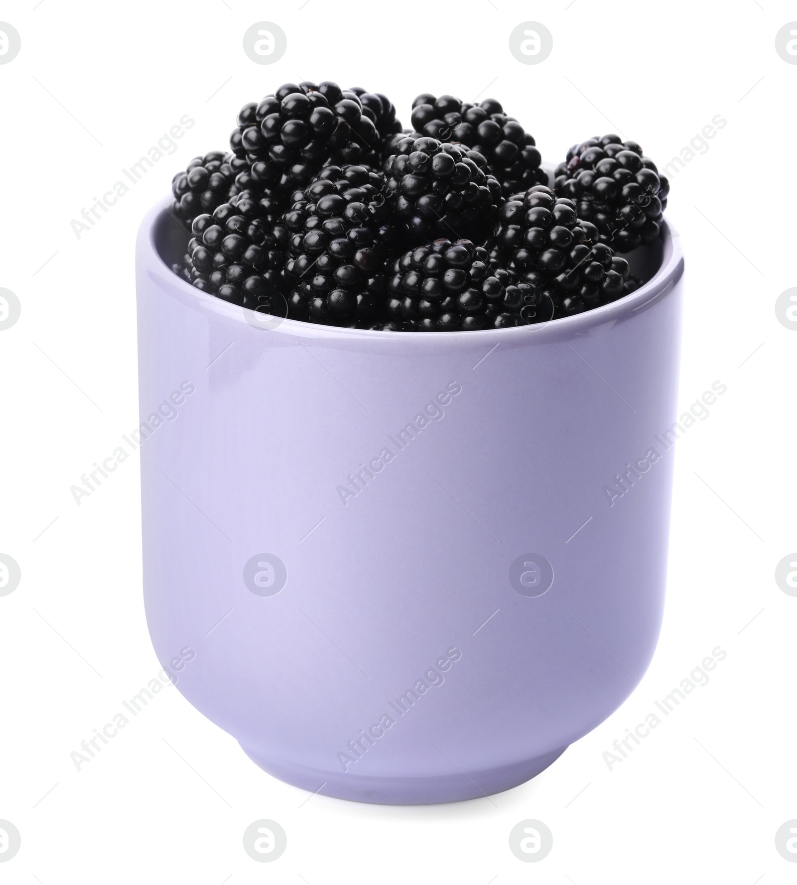 Photo of Purple cup of tasty blackberries on white background