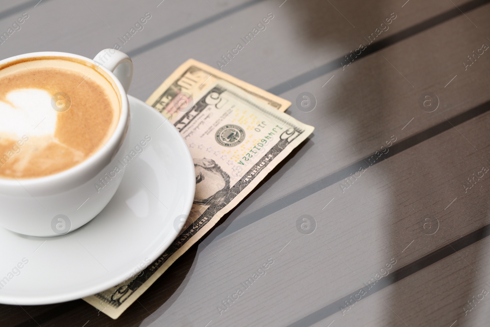 Photo of Tips and coffee on table, space for text