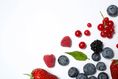 Photo of Mix of fresh berries on white background, flat lay. Space for text