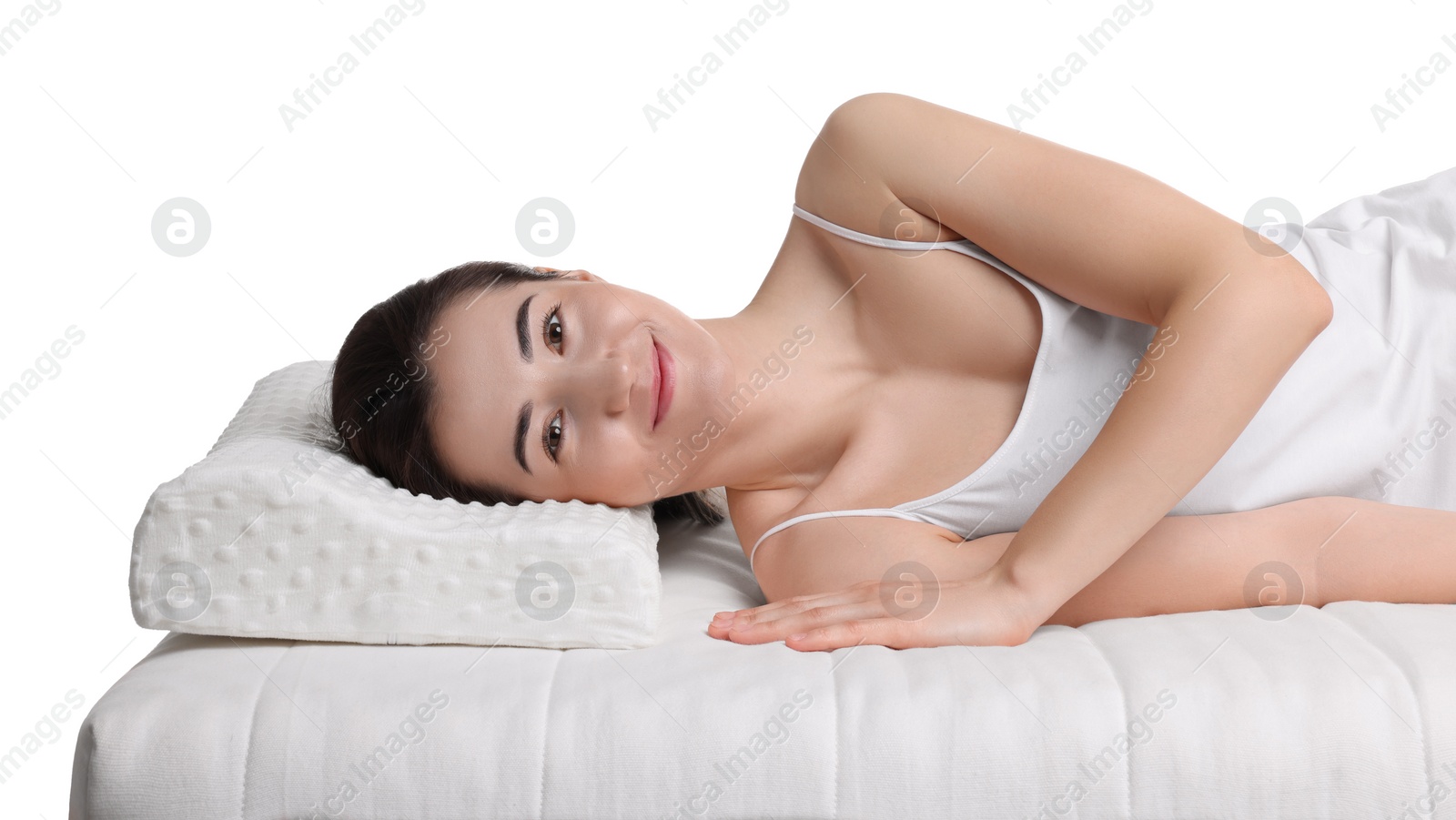 Photo of Woman sleeping on orthopedic pillow against white background