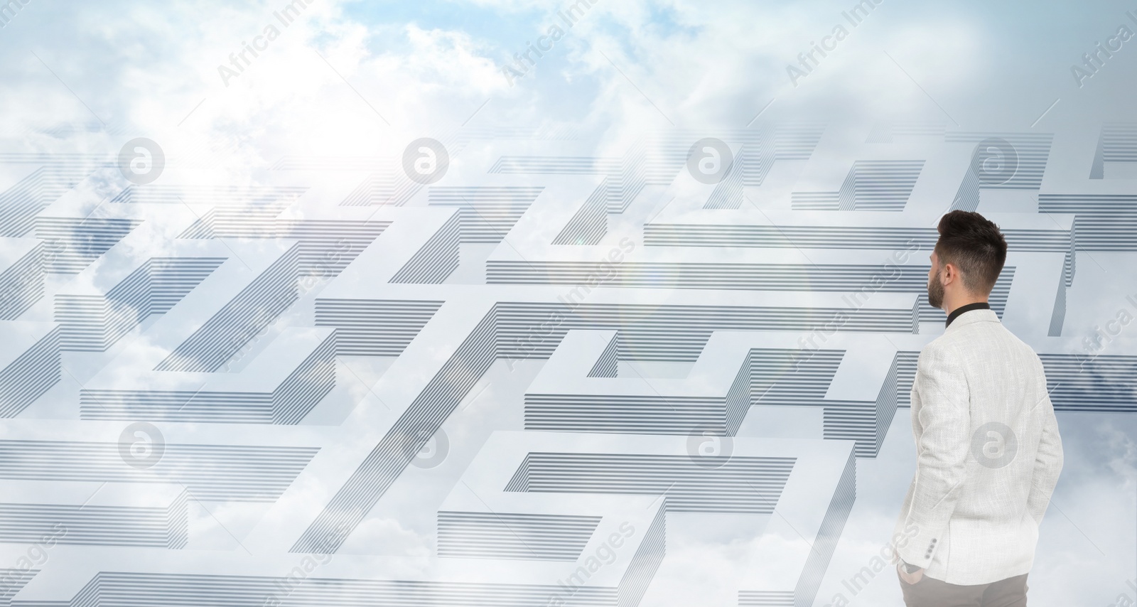 Image of Young businessman looking for way out of maze. Banner design