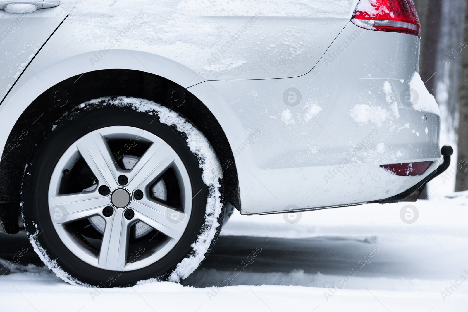 Photo of Car with winter tires on snowy road