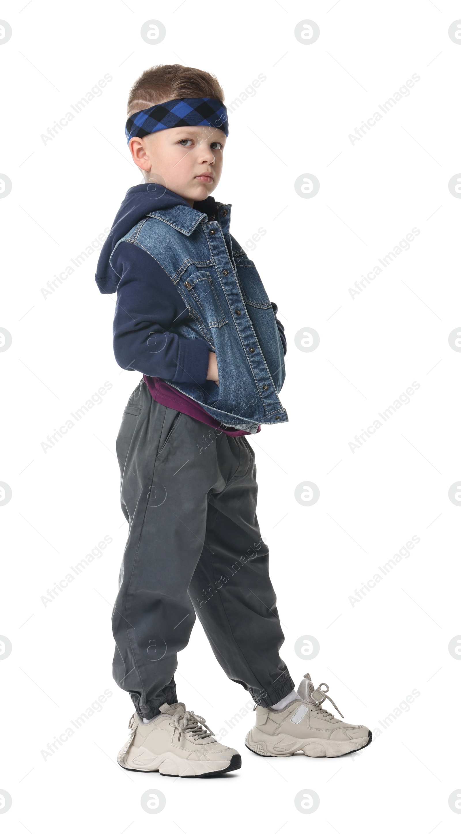 Photo of Happy little boy dancing on white background