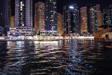 Photo of DUBAI, UNITED ARAB EMIRATES - NOVEMBER 03, 2018: Night cityscape of marina district with illuminated buildings