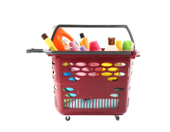 Photo of Shopping basket full of cleaning supplies isolated on white