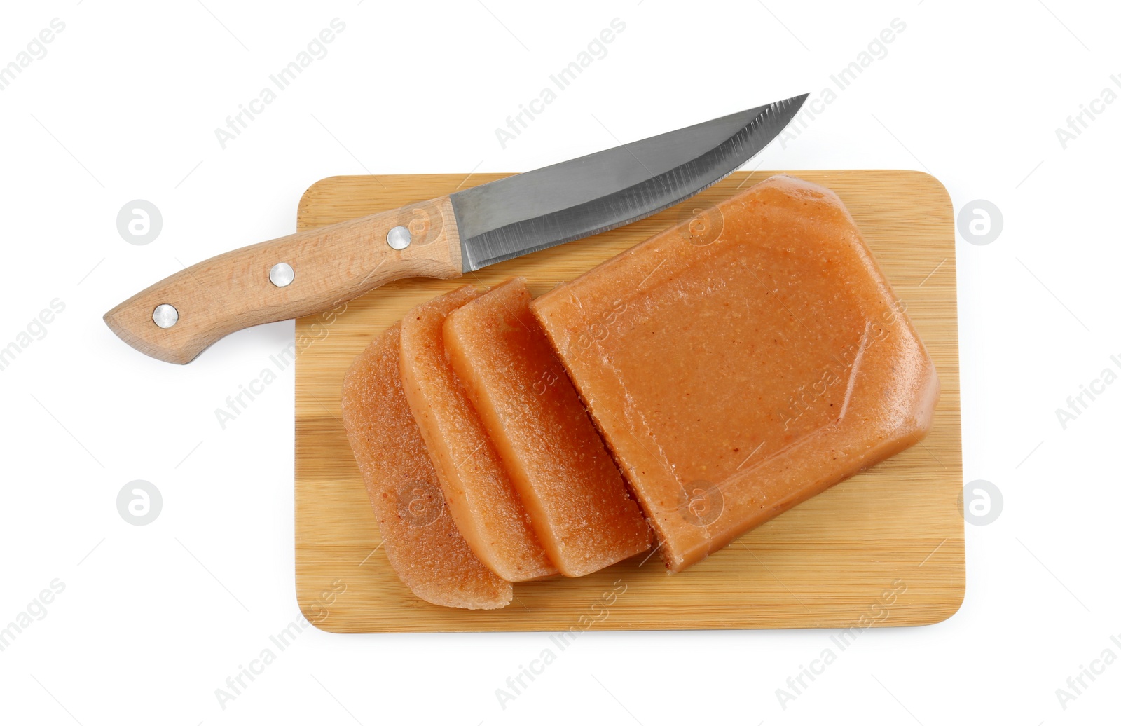 Photo of Delicious sweet quince paste and knife isolated on white, top view