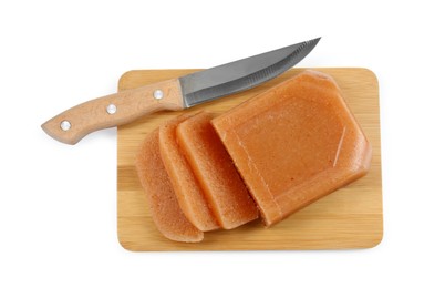 Delicious sweet quince paste and knife isolated on white, top view