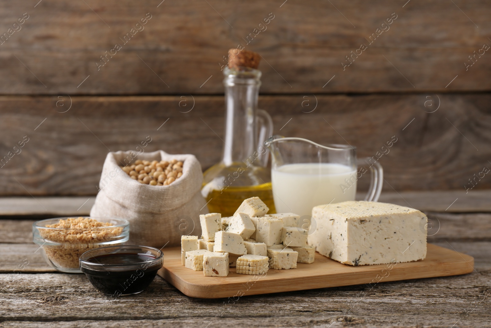 Photo of Different natural soy products on wooden table