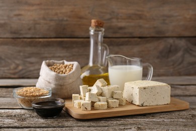 Photo of Different natural soy products on wooden table