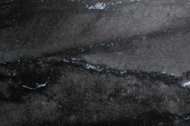 Image of Texture of black marble stone surface as background, closeup