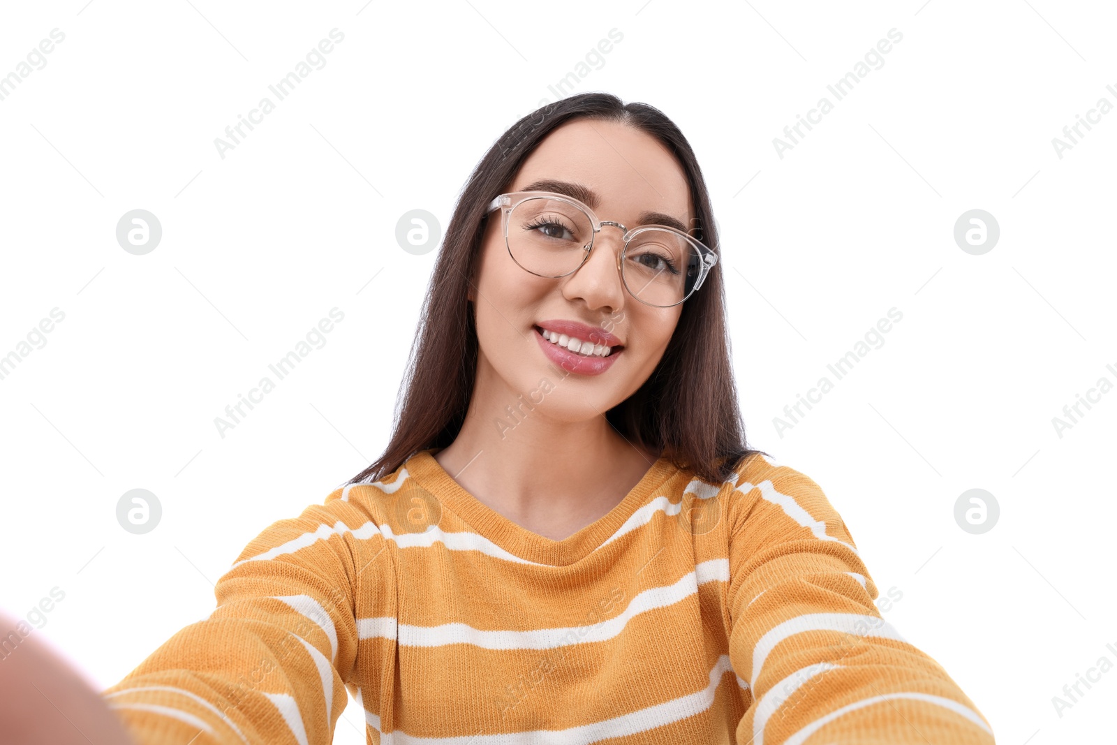 Photo of Smiling young woman taking selfie on white background