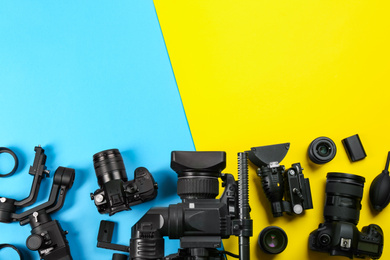 Flat lay composition with video camera and other equipment on color background. Space for text