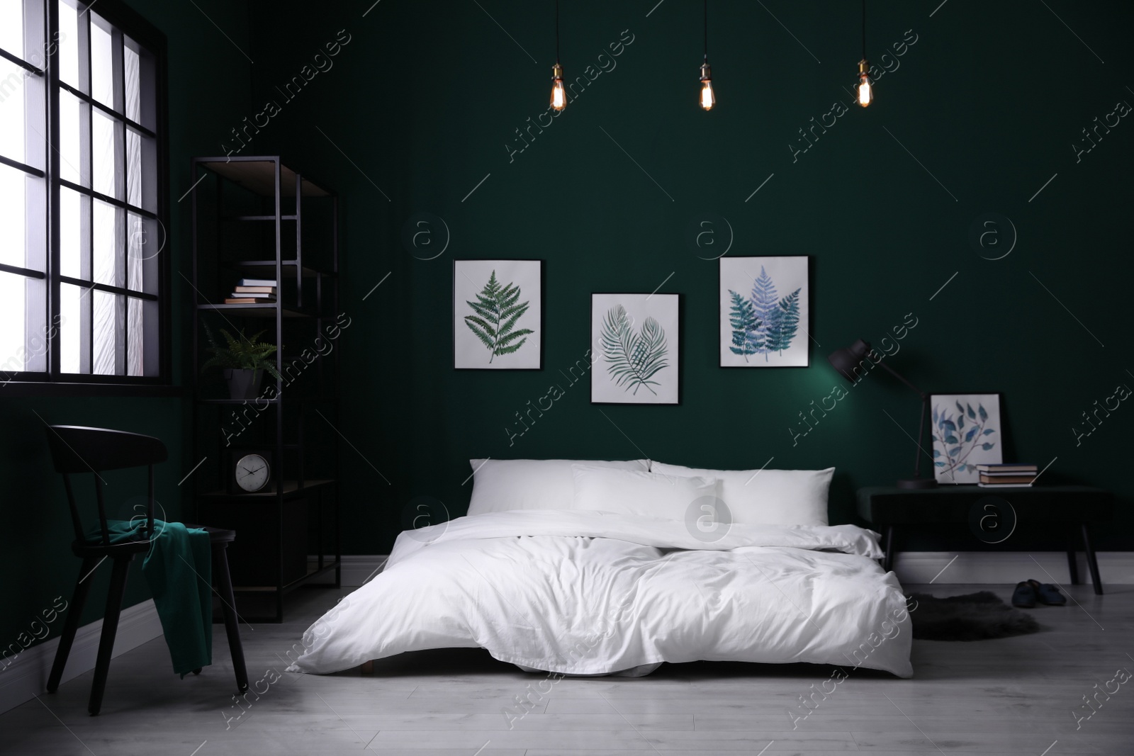 Photo of Comfortable bed with stylish white linens near green wall indoors