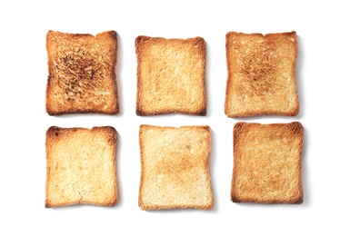 Toasted bread on white background, top view