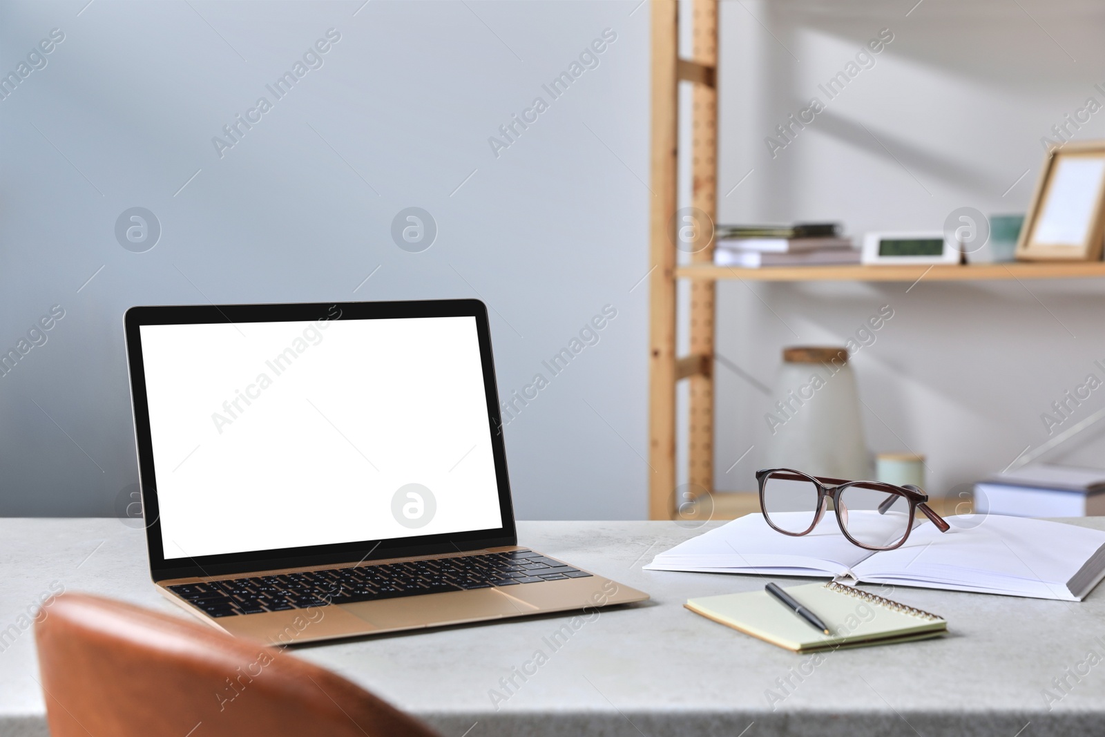 Photo of Workplace with modern laptop on table. Mockup for design