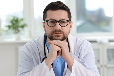 Portrait of doctor with stethoscope in clinic