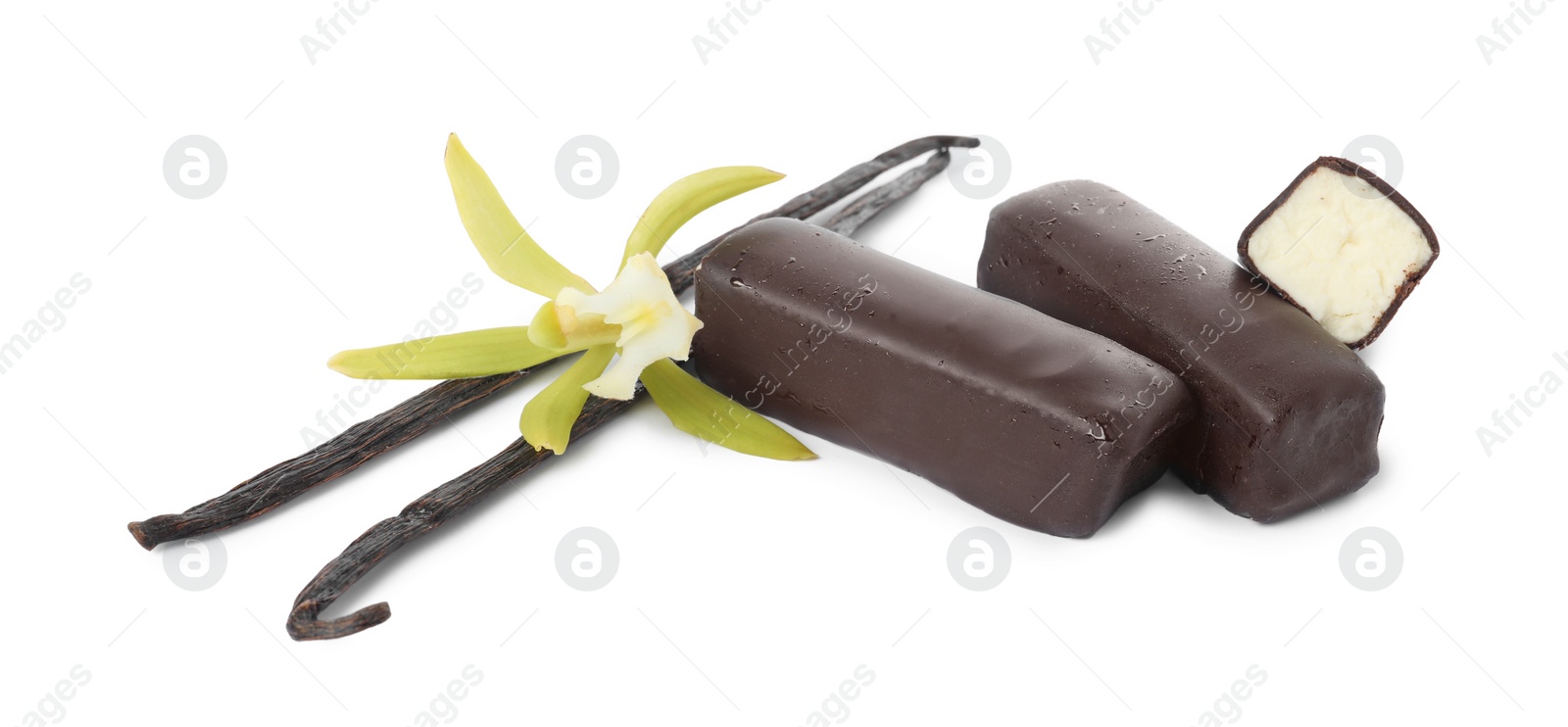 Photo of Glazed curd cheese bars, vanilla pods and flower isolated on white