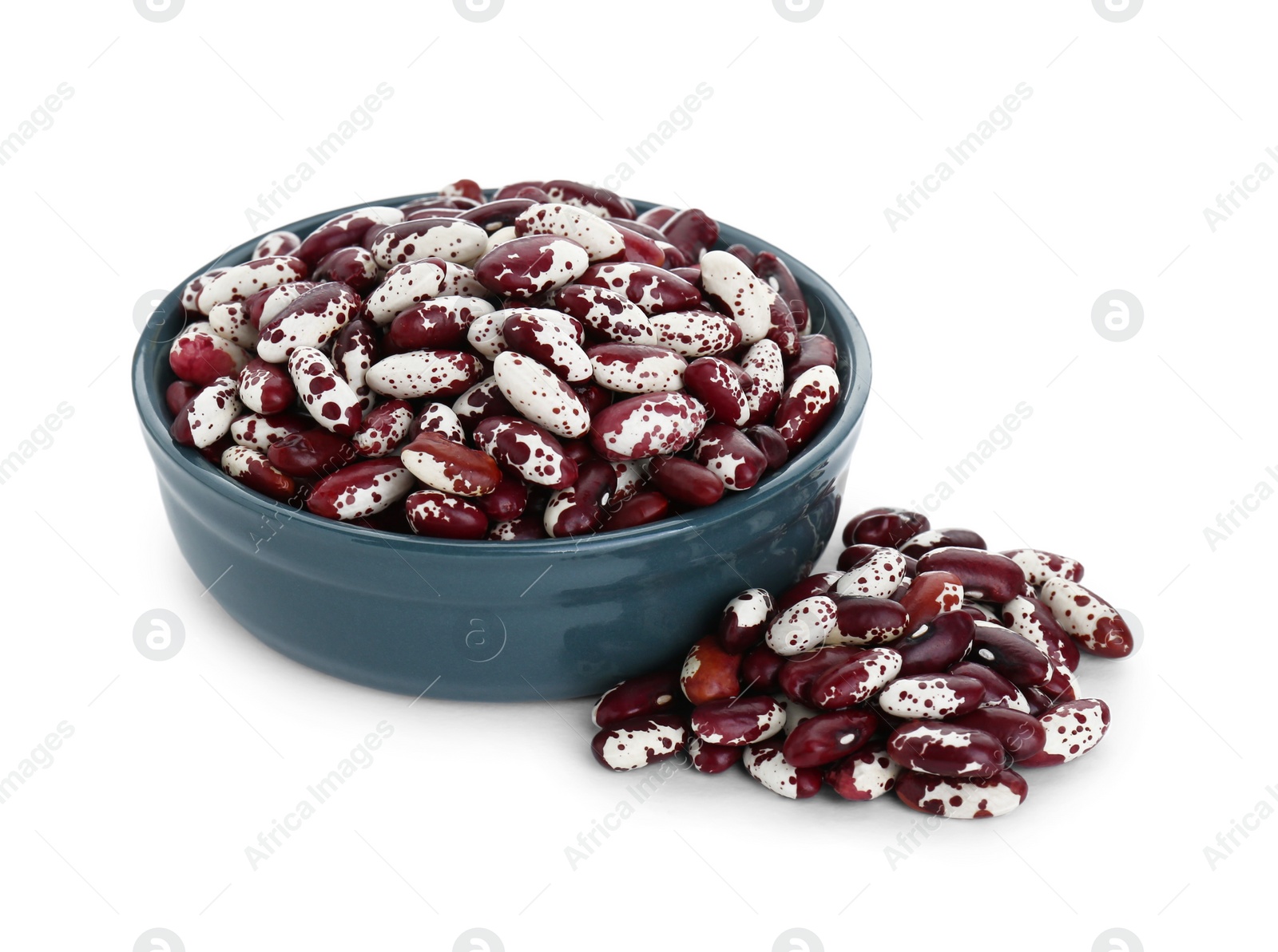 Photo of Bowl and dry kidney beans on white background