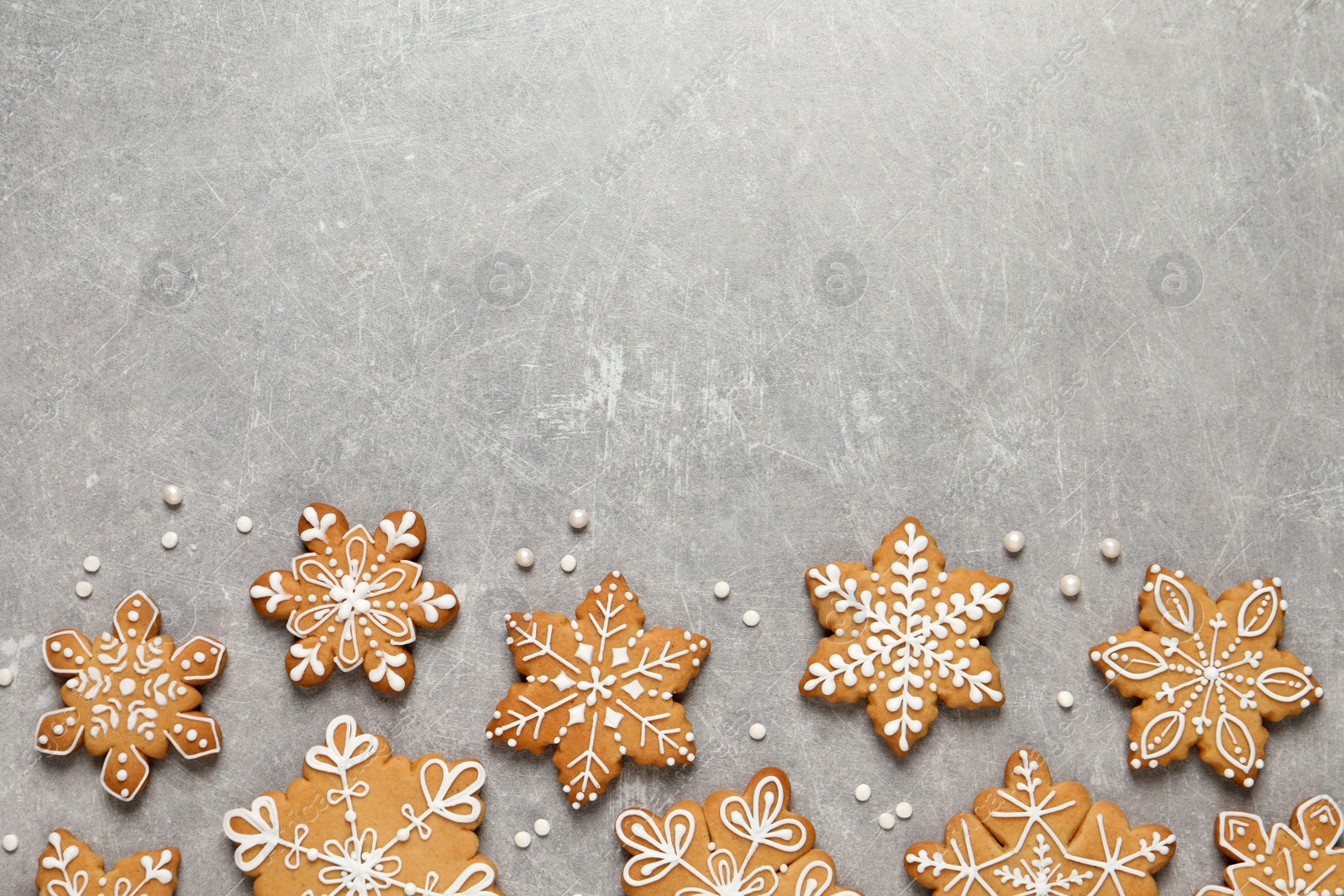 Photo of Tasty Christmas cookies on light grey table, flat lay. Space for text