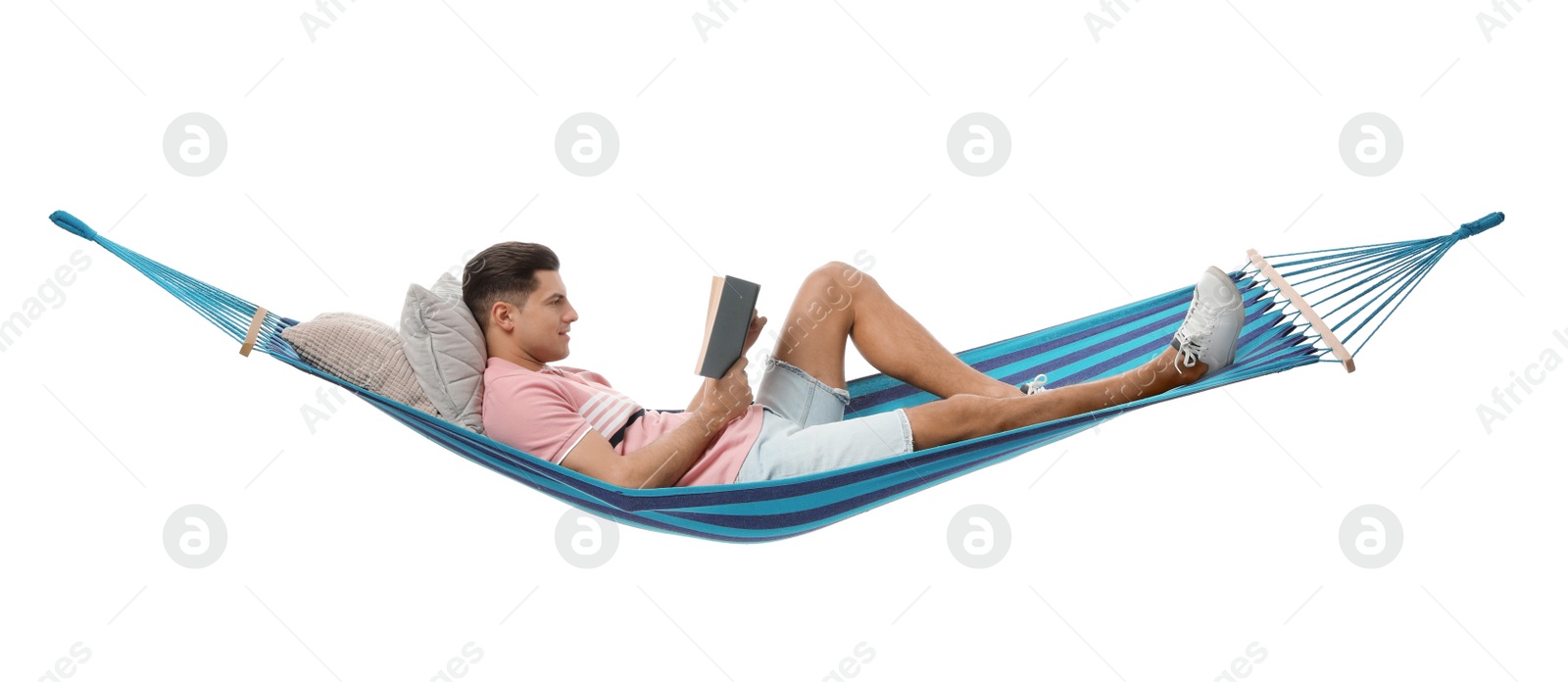 Photo of Man reading book in hammock on white background