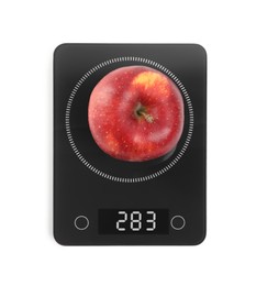 Photo of Ripe red apple and electronic scales on white background, top view