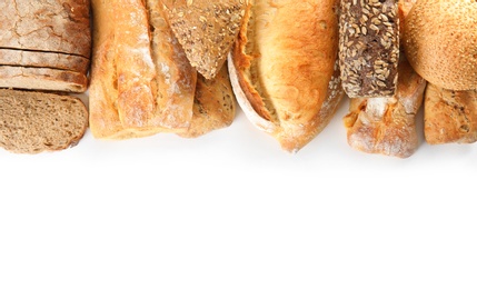 Photo of Different kinds of bread on white background, top view