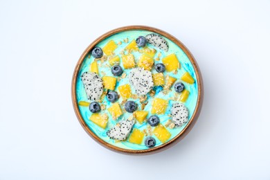 Delicious smoothie bowl with fresh fruits, blueberries and oatmeal on white background, top view