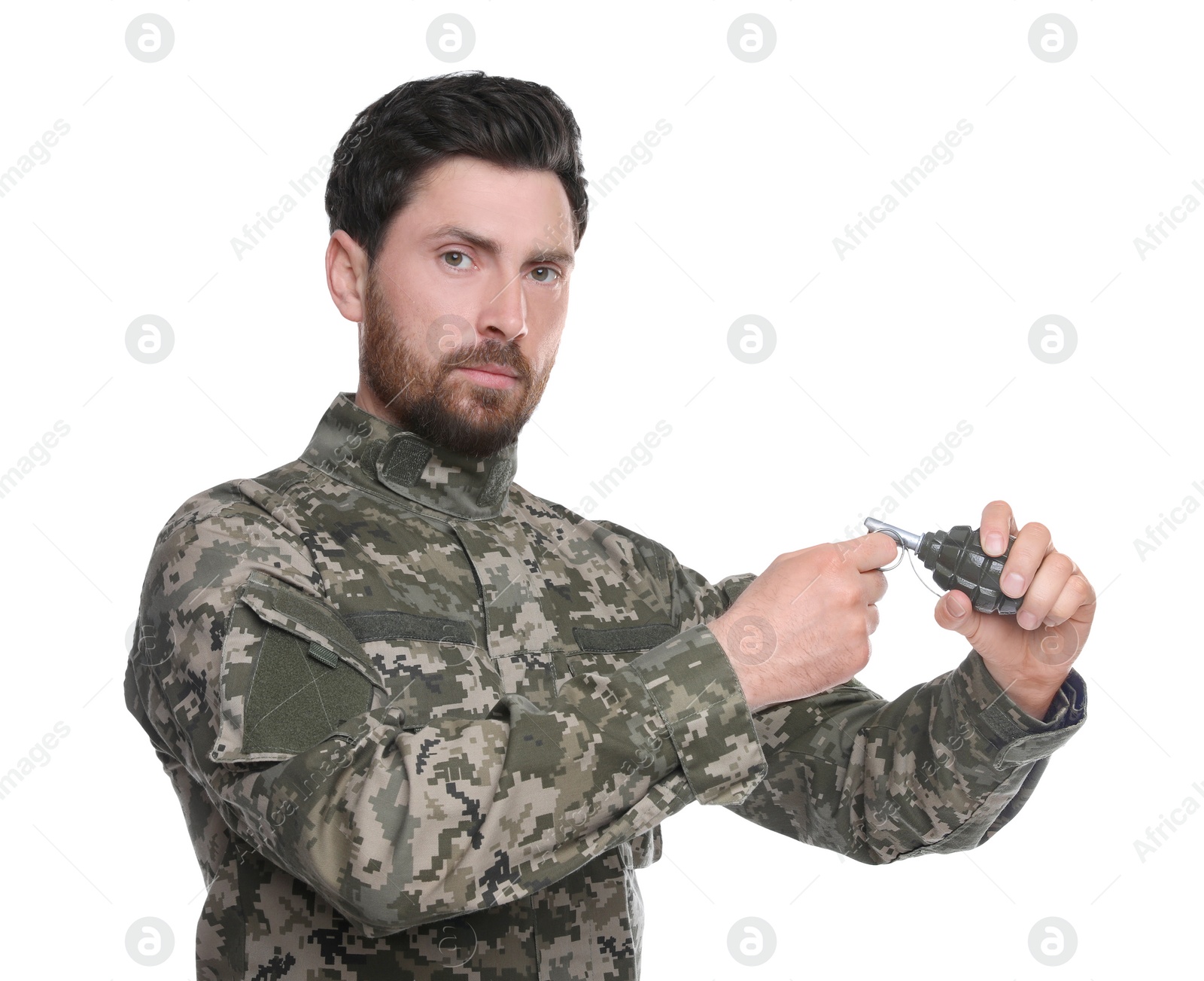 Photo of Soldier pulling safety pin out of hand grenade on white background. Military service