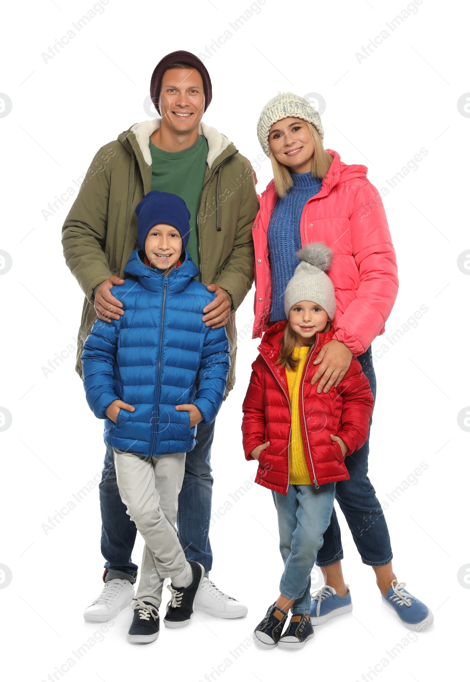 Photo of Happy family with children in warm clothes on white background. Winter season