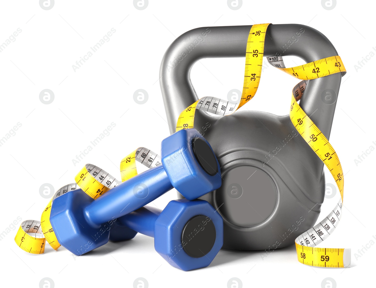 Photo of Dumbbells, measuring tape and kettlebell isolated on white