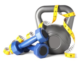 Photo of Dumbbells, measuring tape and kettlebell isolated on white