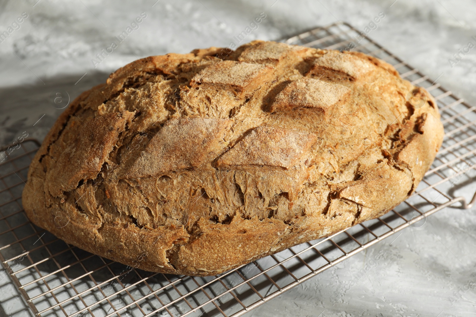 Photo of Freshly baked sourdough bread on grey table