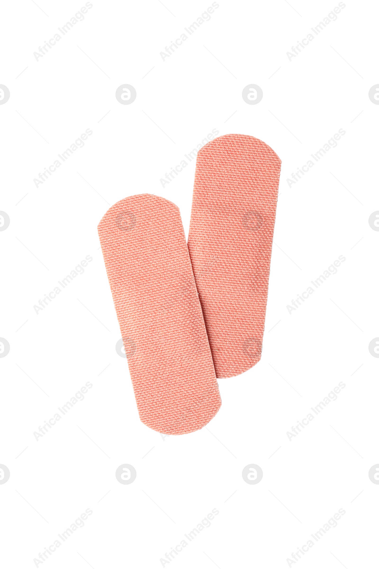 Medical sticking plasters isolated on white. First aid item Photo of Medical sticking plasters isolated on white. First aid item
