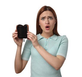 Confused woman with empty wallet on white background