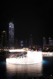 DUBAI, UNITED ARAB EMIRATES - NOVEMBER 04, 2018: Famous dancing fountain show on Burj Khalifa lake at night