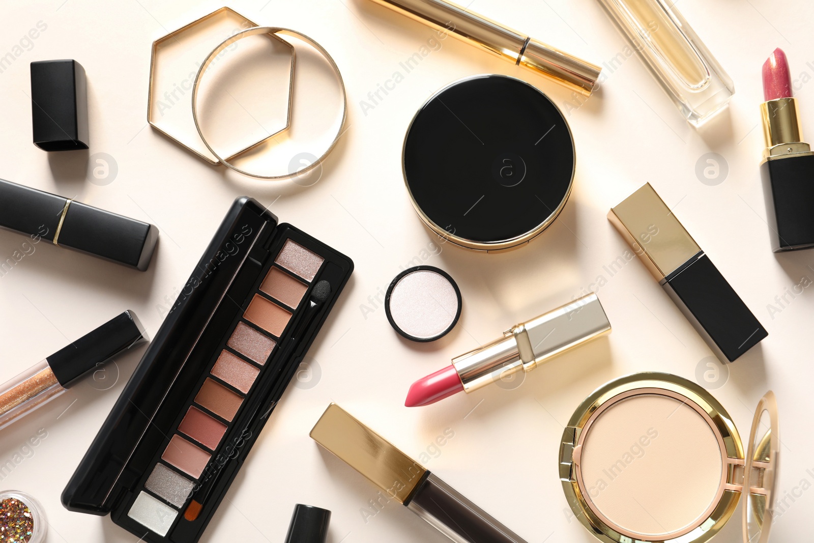 Photo of Different luxury makeup products on color background, flat lay