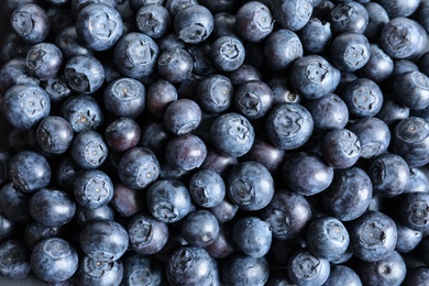 Fresh raw blueberries as background, top view