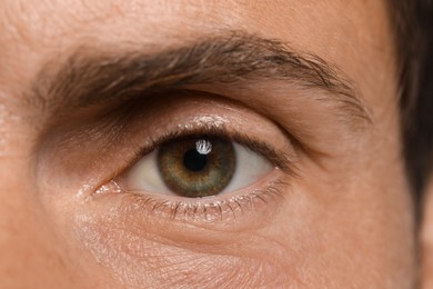 Photo of Handsome adult man as background, closeup of eye