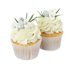 Photo of Tasty Easter cupcakes with vanilla cream isolated on white