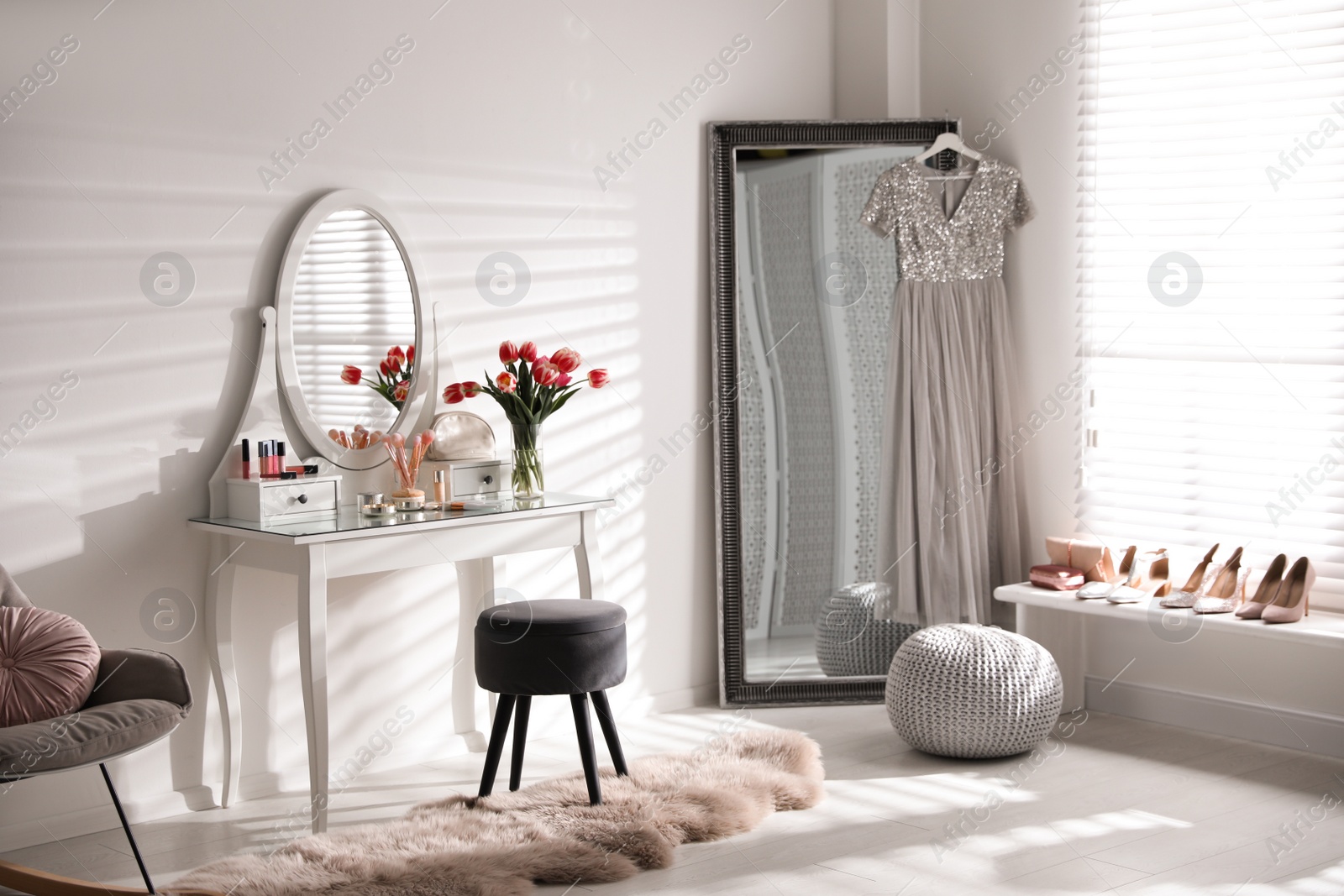 Photo of Stylish room interior with elegant dressing table and mirror