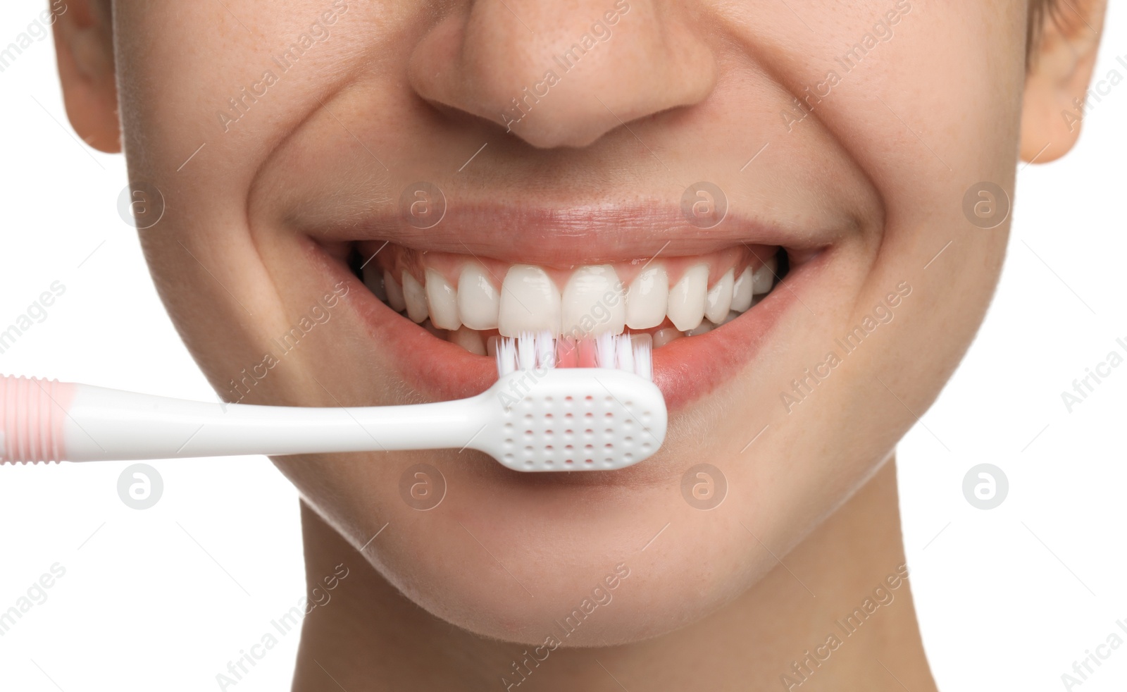 Photo of Woman brushing teeth on white background, closeup. Dental care