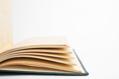 Closeup view of open book on white background