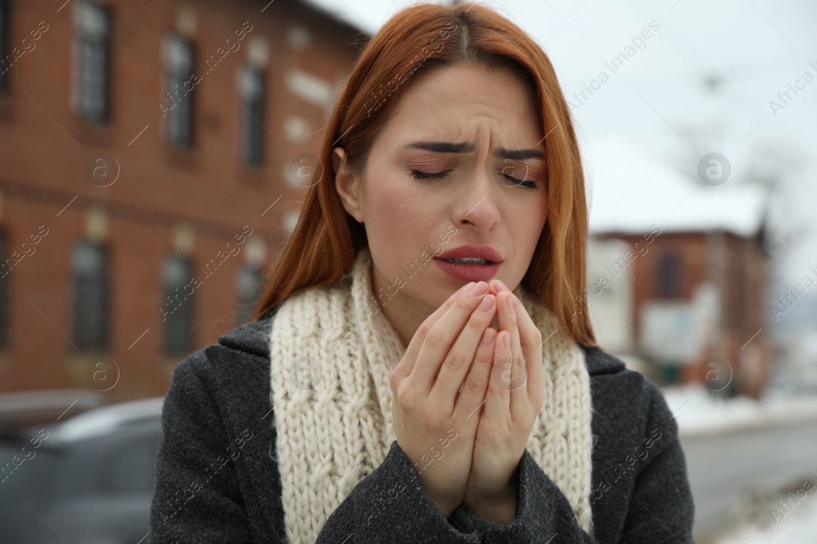 Photo of Beautiful young woman coughing outdoors. Cold symptoms