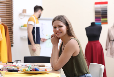 Fashion designer creating new clothes in studio