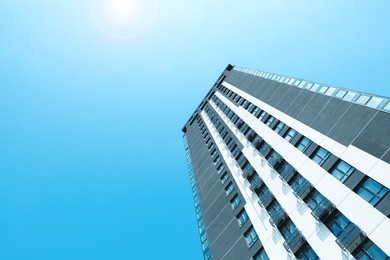 Low angle view of modern building against blue sky