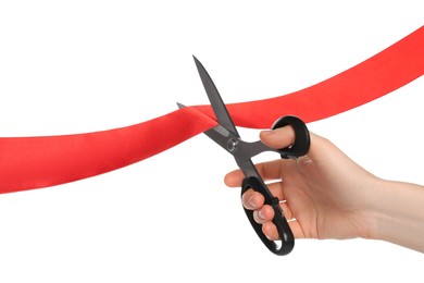 Photo of Man cutting red ribbon on white background, closeup