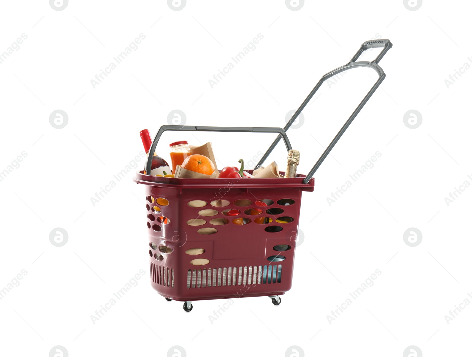 Photo of Shopping basket full of different products isolated on white