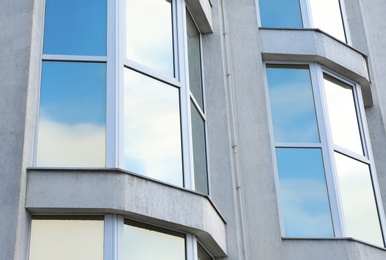 Modern office building with tinted windows. Urban architecture