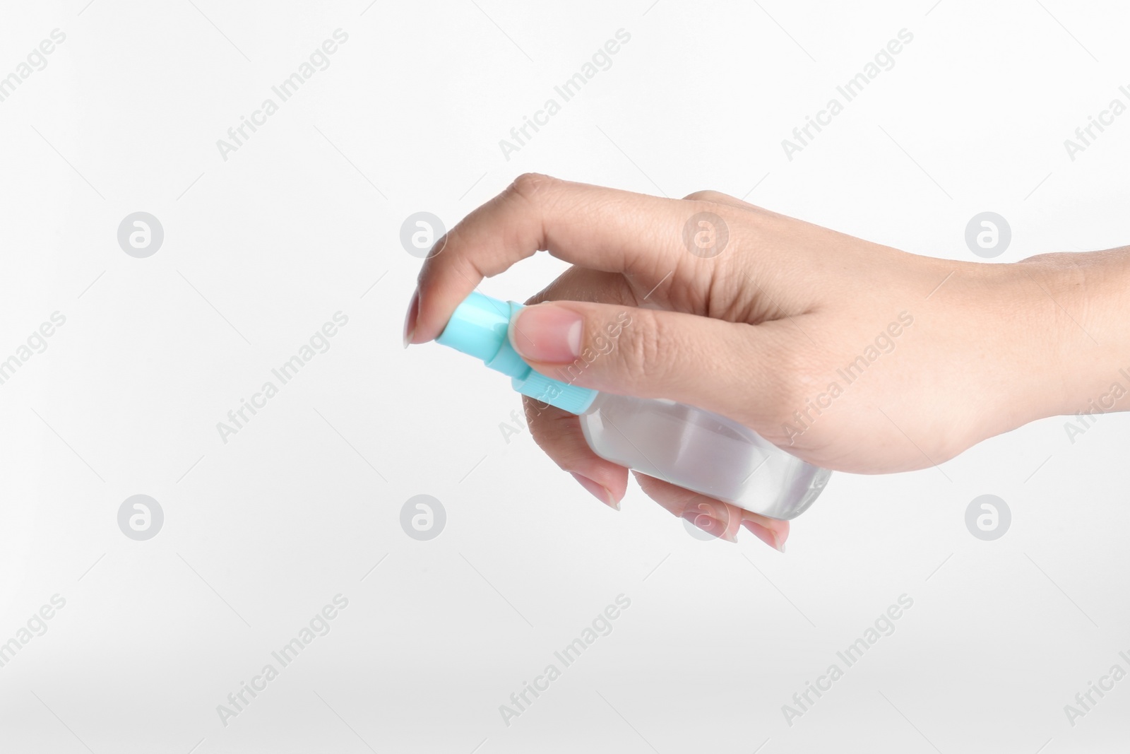 Photo of Woman holding antiseptic spray on white background, closeup